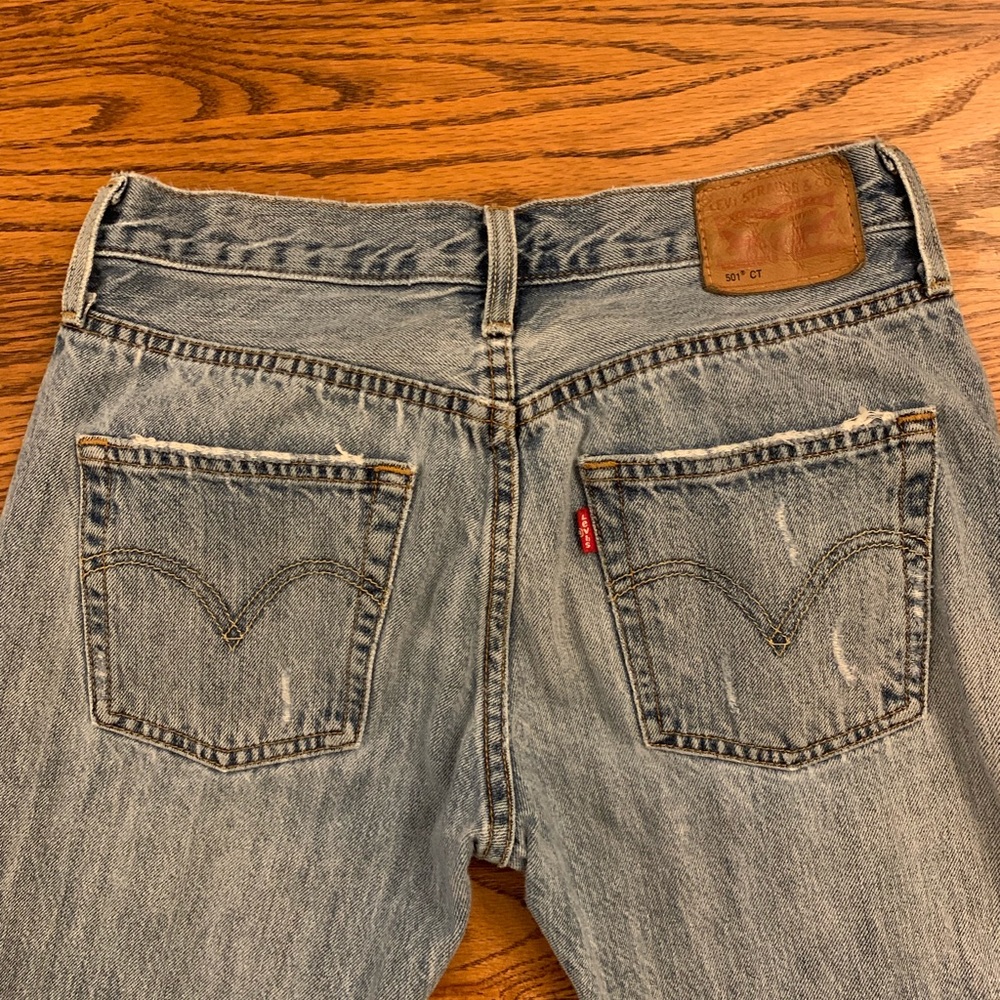 Levi’s mid-rise cropped distressed jeans